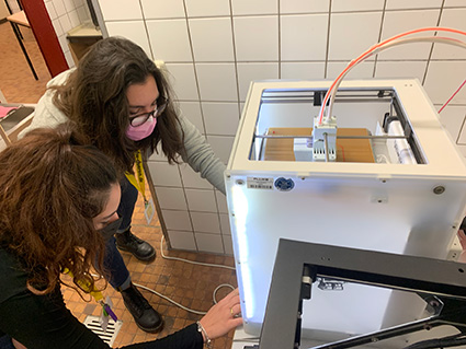 Two participants from Institute Rittmeyer controlling a 3D printer
